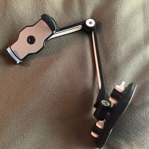 EUC phone/tablet holder. Suctions to a table, etc. Holder goes to approx 7”